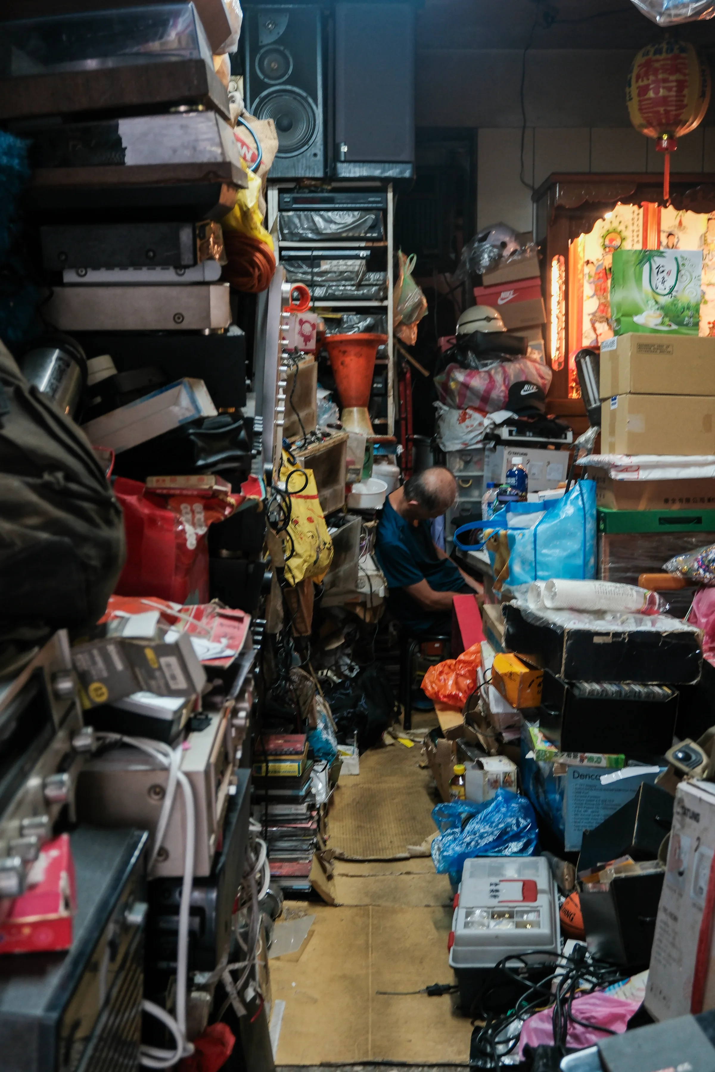 Man in cluttered store