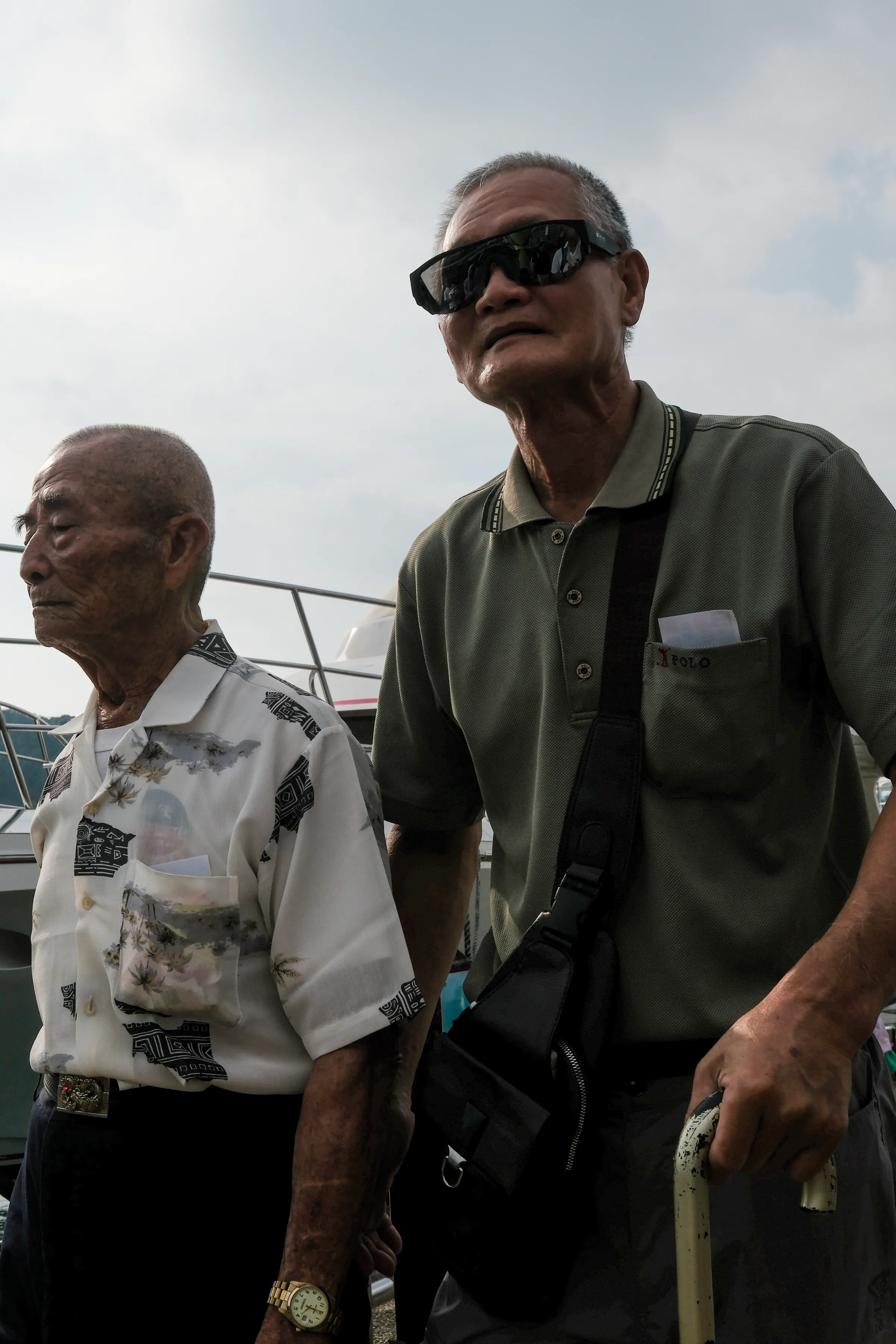 Old men by ship
