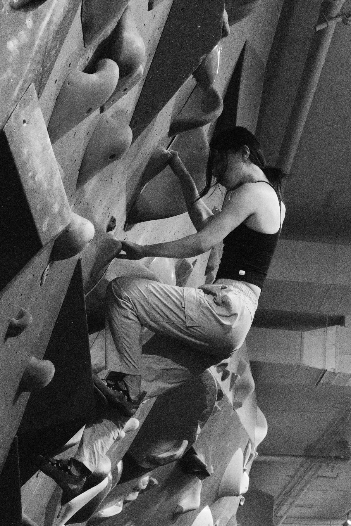 Girl climbing at gym