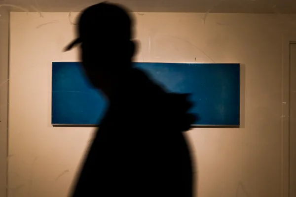 Silhouette in front of blue